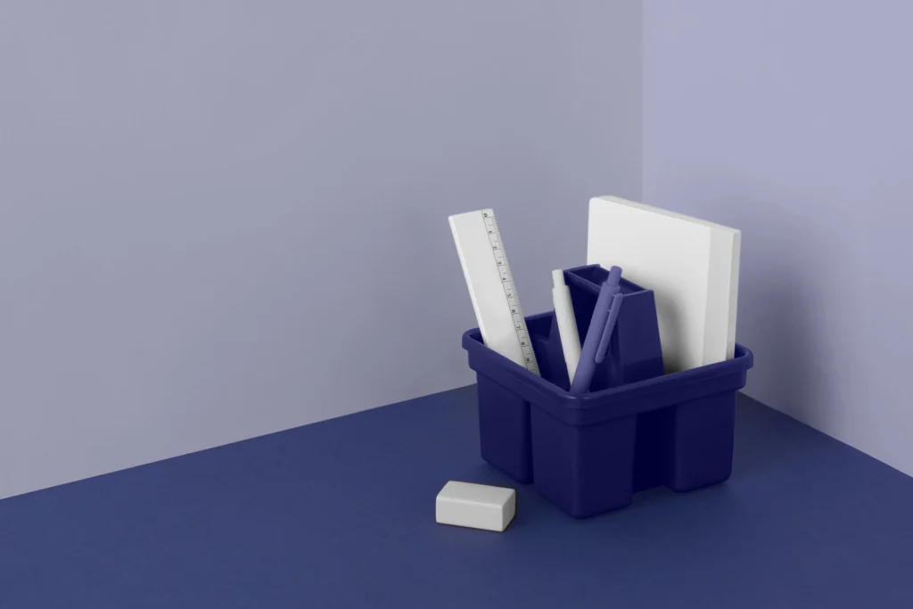 A blue container with some papers and a piece of paper