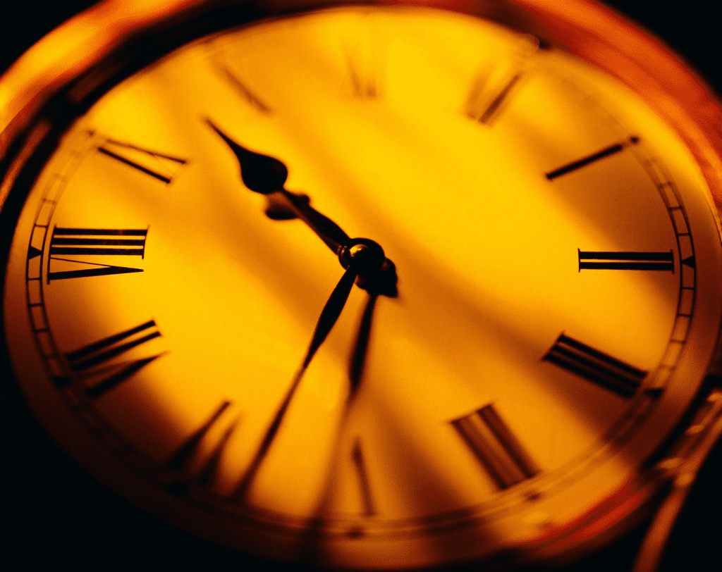 A clock with roman numerals is shown in this image.