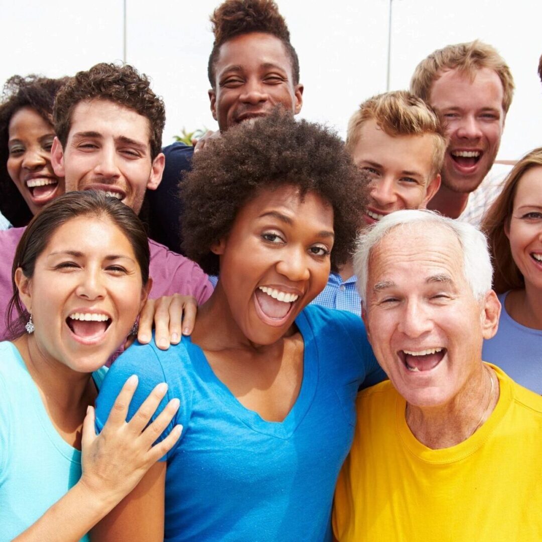 A group of people that are smiling for the camera