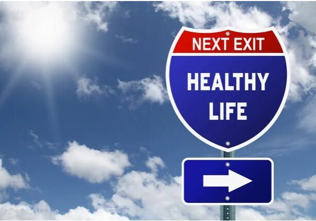 A road sign that says next exit healthy life